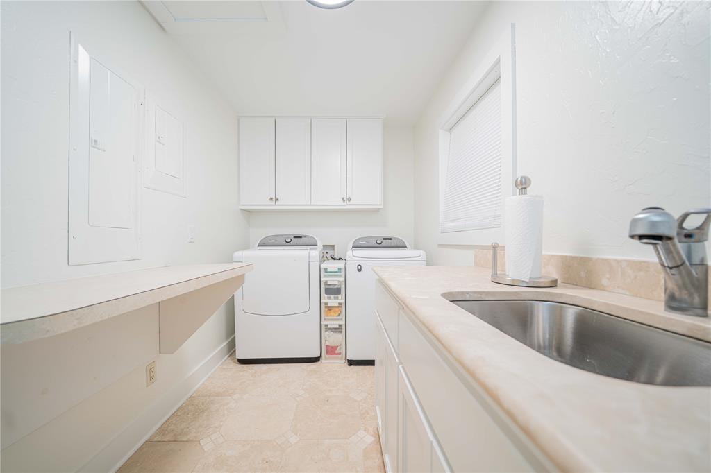 582 Windy Point Mount Vernon, TX 75457 - Photo 29 of 38 Laundry area featuring cabinet space and washer and dryer