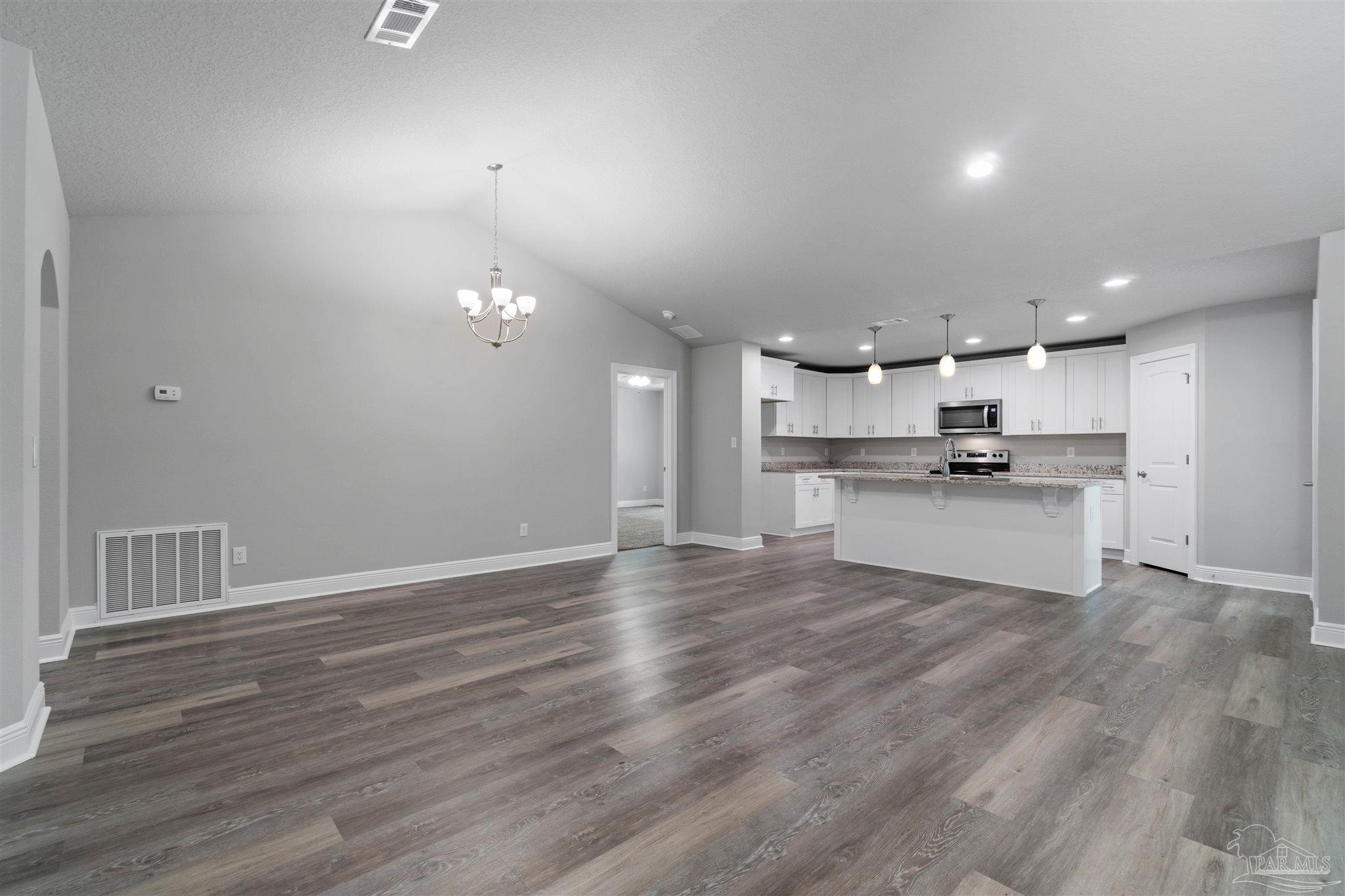 4289 Carl Booker Road Milton, FL 32583 - Photo 15 of 40 a view of kitchen with wooden floor