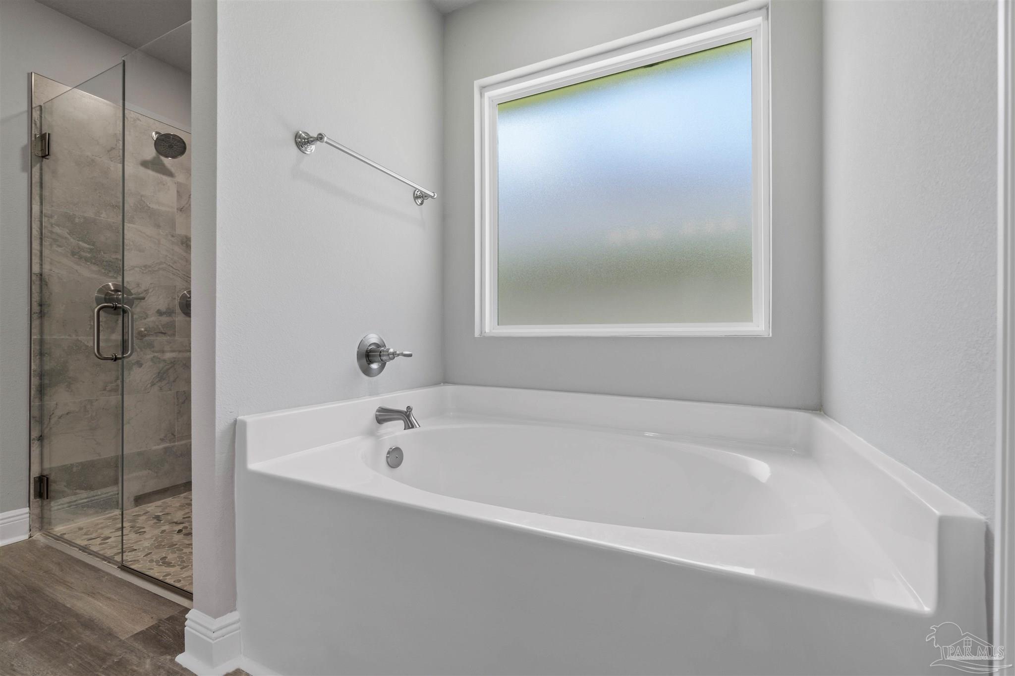 4289 Carl Booker Road Milton, FL 32583 - Photo 28 of 40 a white bath tub sitting next to a shower