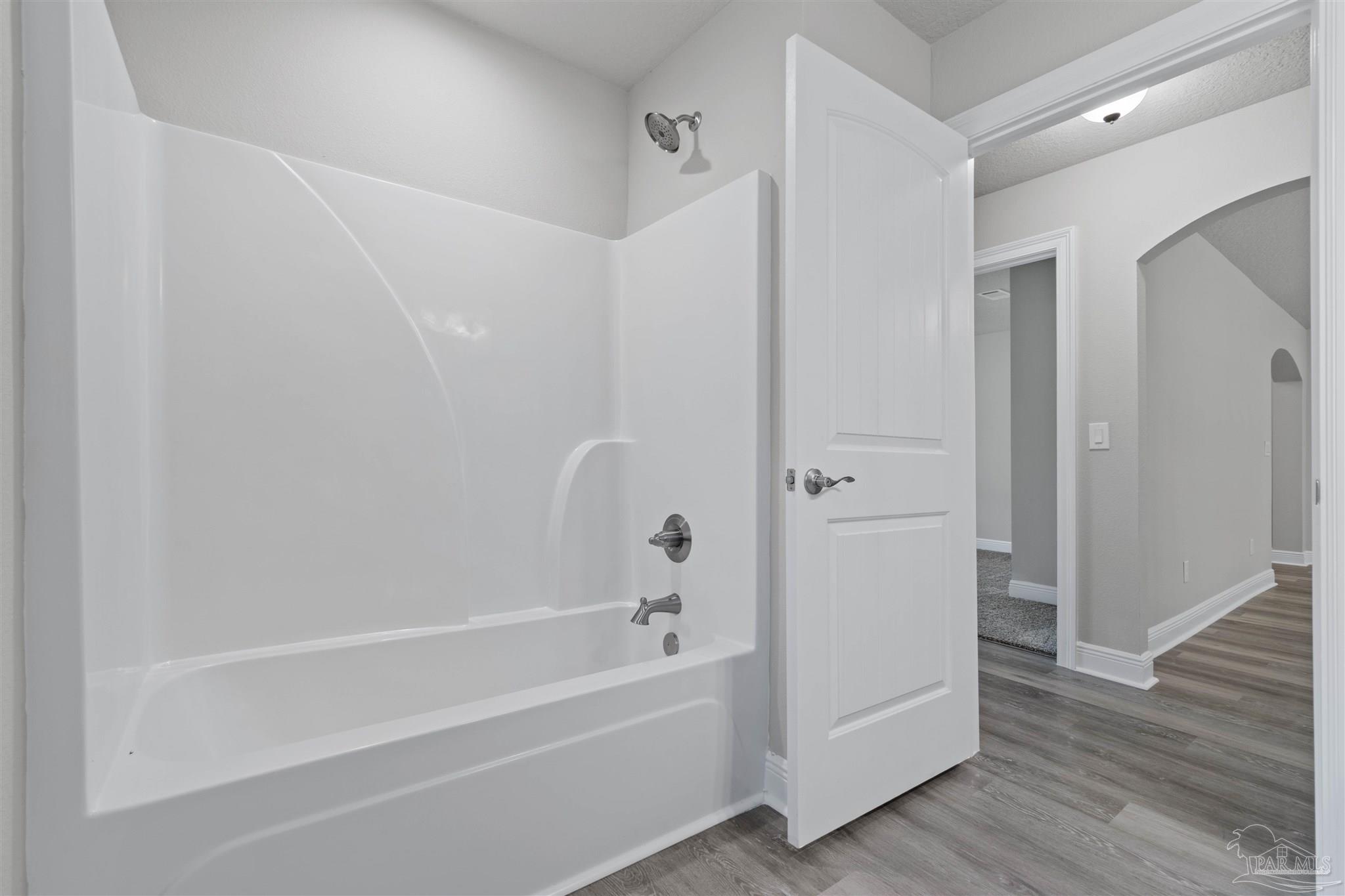 4289 Carl Booker Road Milton, FL 32583 - Photo 35 of 40 a bathroom with a bathtub and a shower