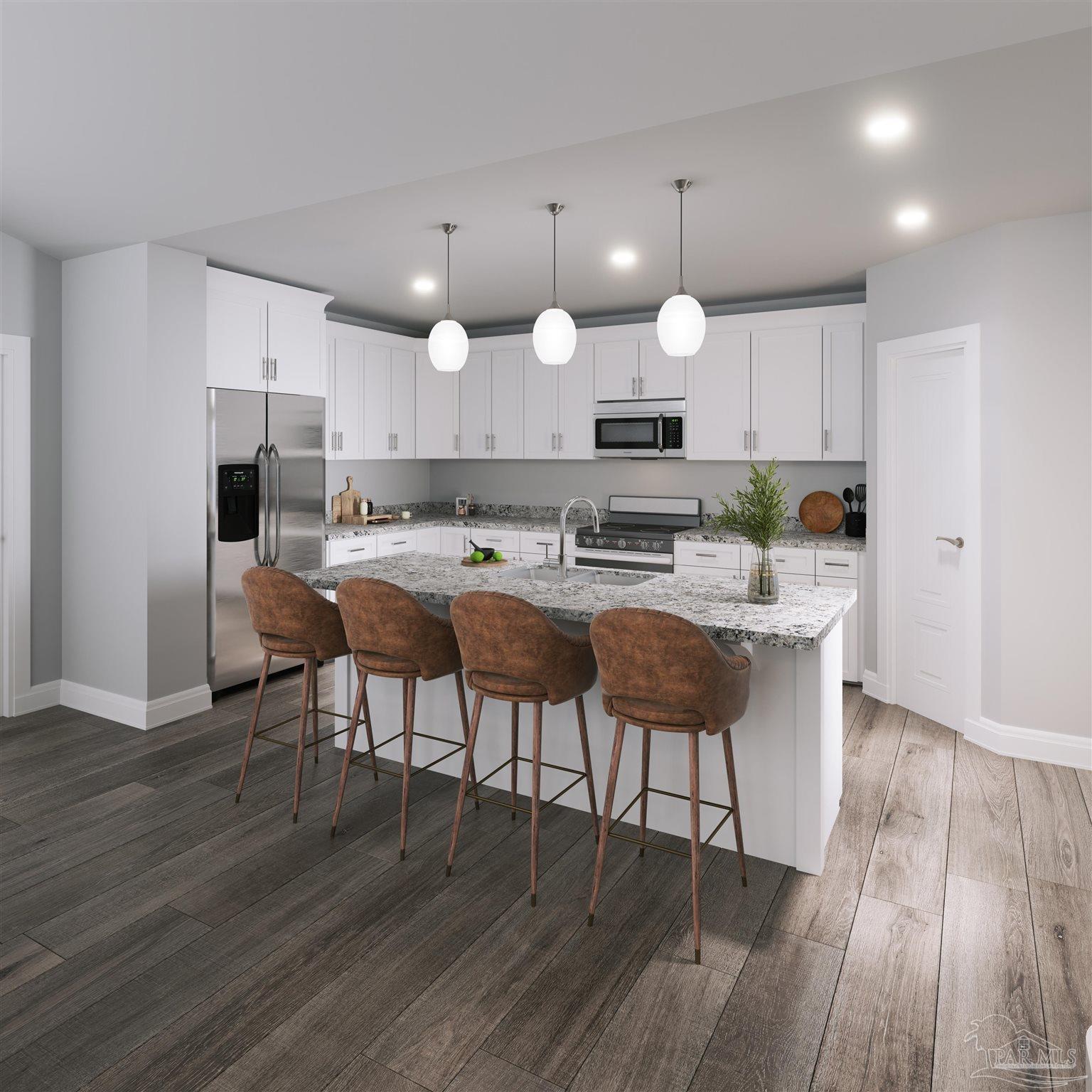 4289 Carl Booker Road Milton, FL 32583 - Photo 6 of 40 a kitchen with kitchen island granite countertop a sink a stove a dining table and chairs