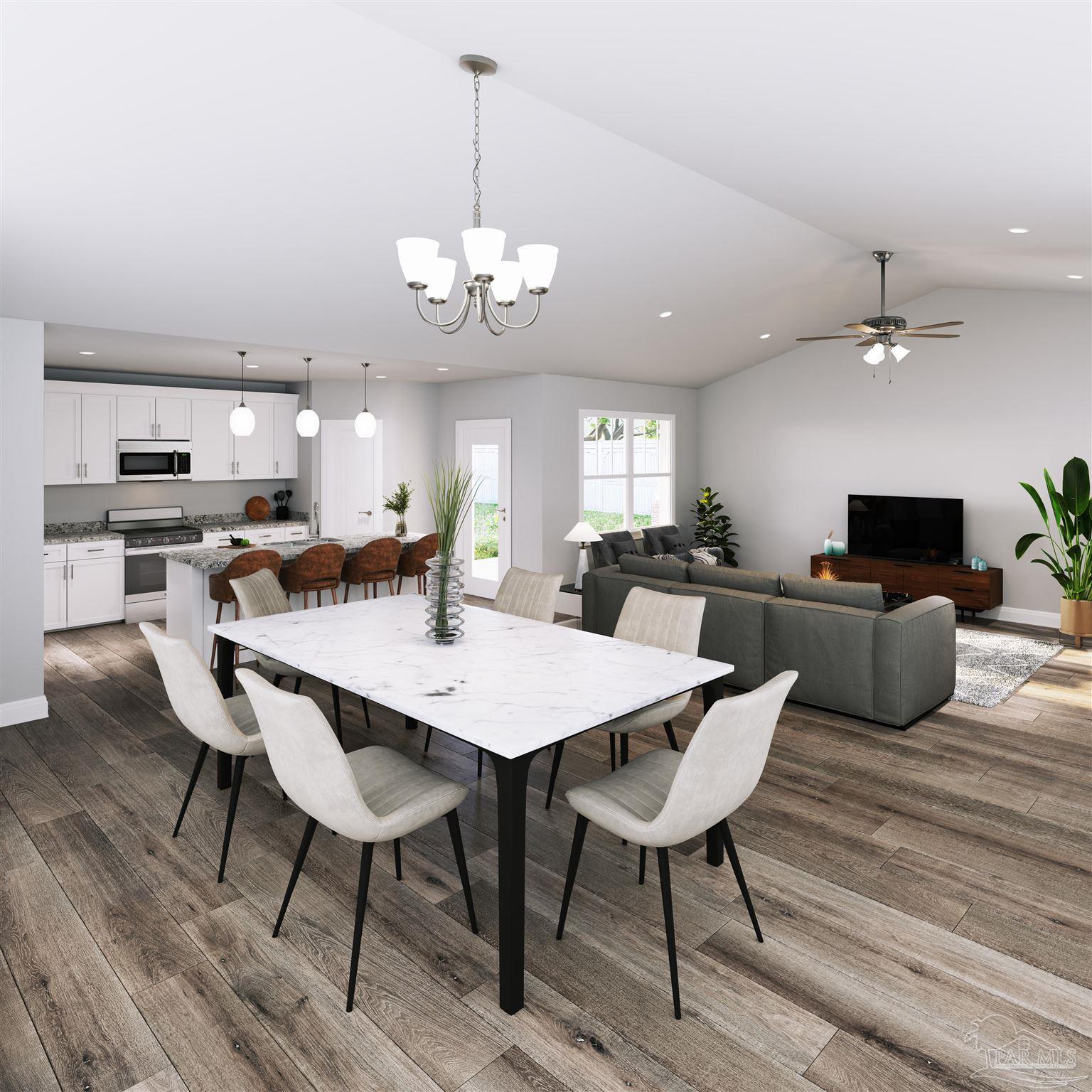 4289 Carl Booker Road Milton, FL 32583 - Photo 7 of 40 a view of a dining room with furniture wooden floor and chandelier