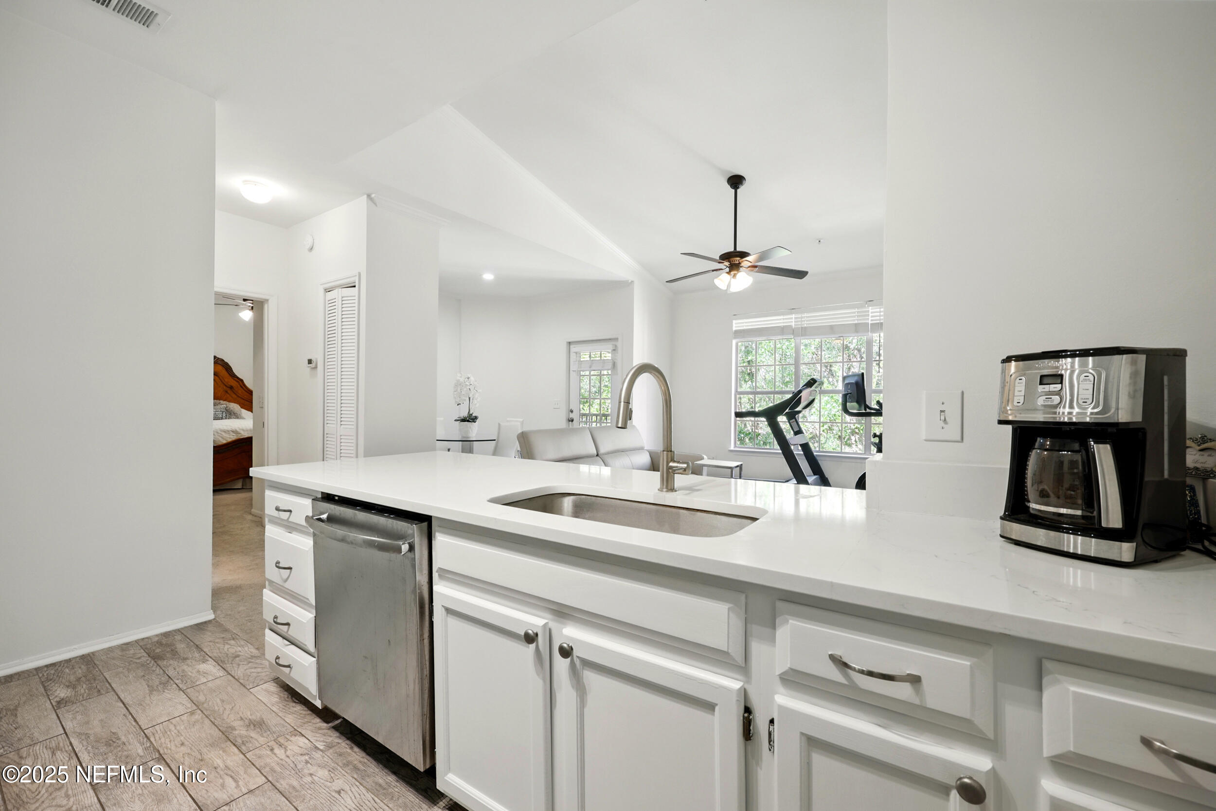 150 Veracruz Drive, Unit 537 Ponte Vedra Beach, FL 32082 - Photo 8 of 14 a kitchen with a sink and refrigerator
