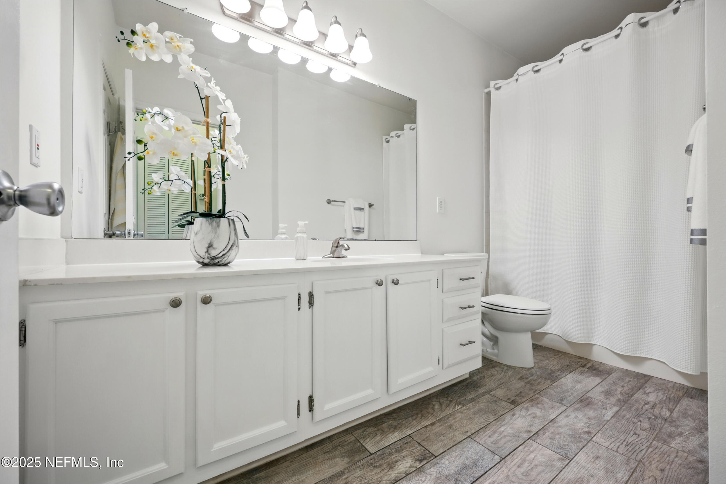 150 Veracruz Drive, Unit 537 Ponte Vedra Beach, FL 32082 - Photo 10 of 14 a spacious bathroom with a double vanity sink mirror and toilet