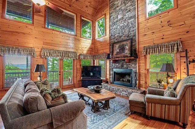 a dining hall with stainless steel appliances granite countertop a table and chairs
