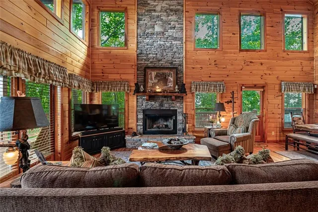 a large kitchen with stainless steel appliances wooden cabinets a stove and a refrigerator