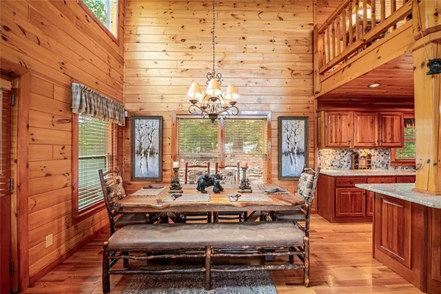 a bed sitting in a spacious bedroom next to a window