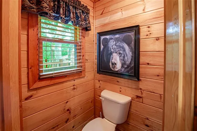 a living room with furniture fireplace and a large window