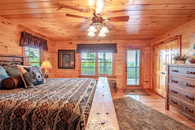 a bedroom with a large bed and a window