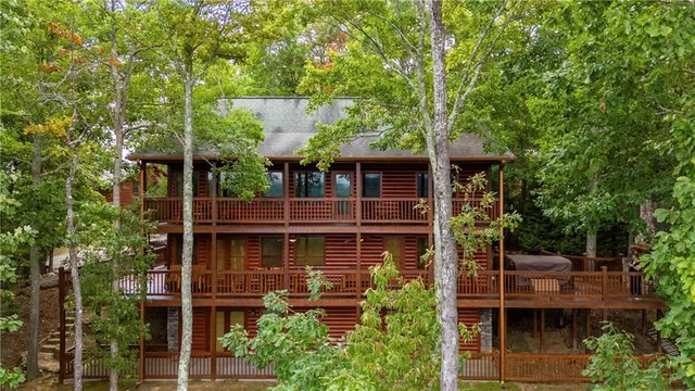 a view of a house with a yard and tree s
