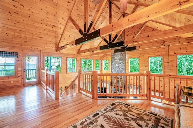 a view of a house with backyard and wooden fence