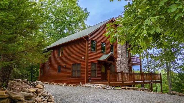 a view of a balcony with chairs and wooden floor