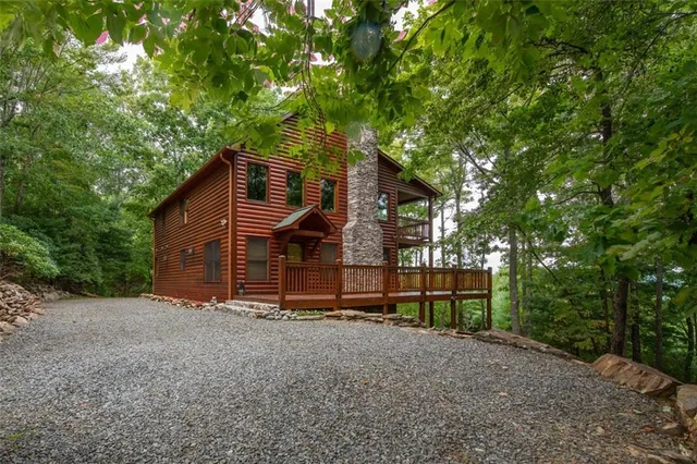 a living room with furniture fireplace and flat screen tv