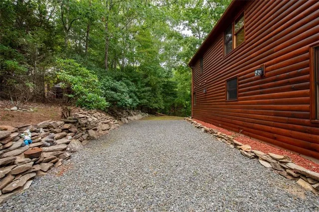 a view of a patio with couches table and chairs and potted plants