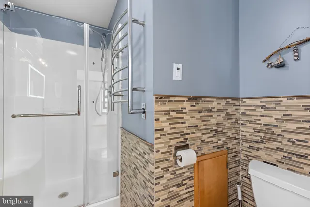 a bathroom with a shower and a sink