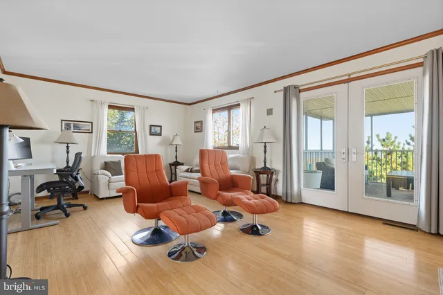 a living room with furniture window and wooden floor