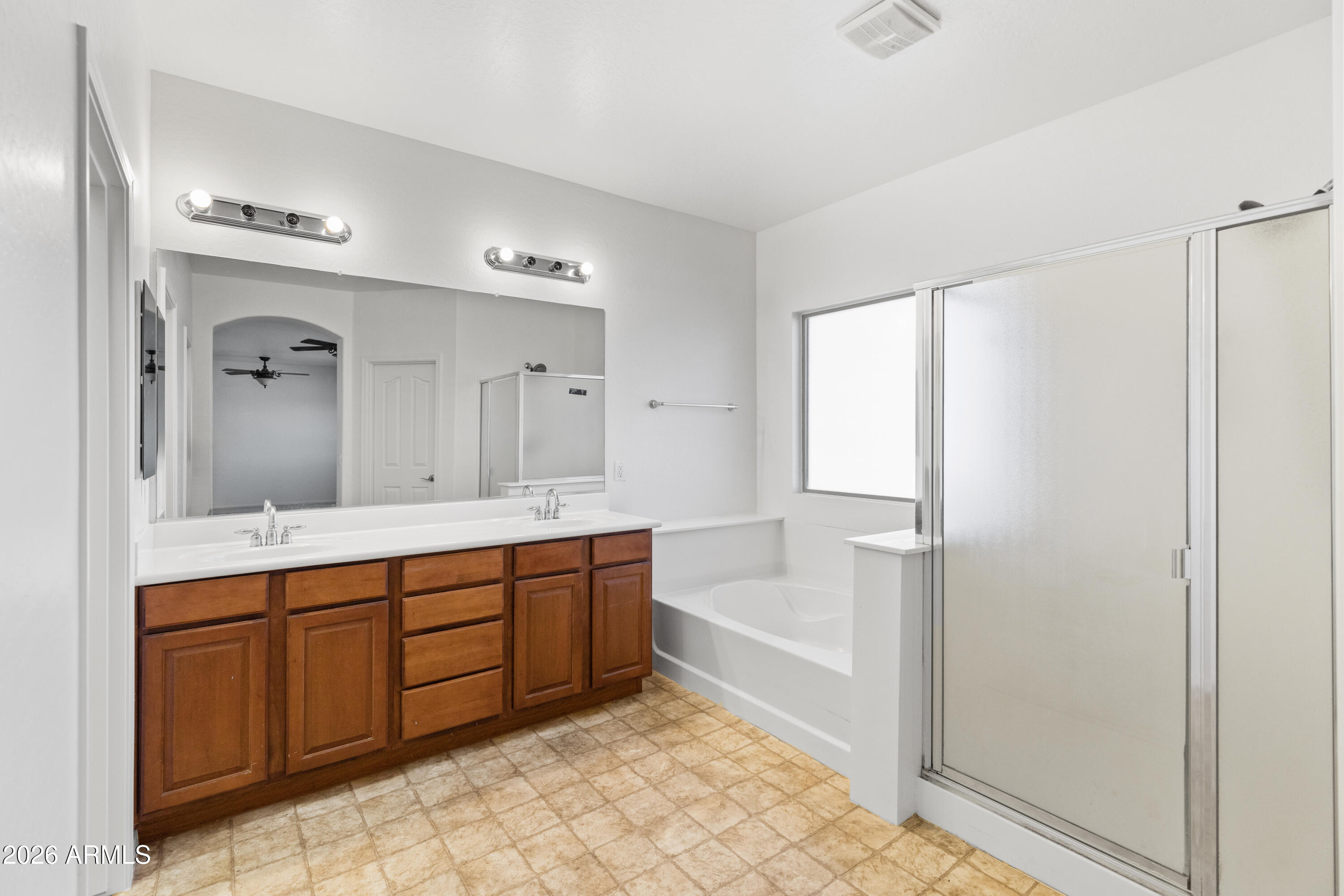 9840 Tangerine Road Florence, AZ 85132 - Photo 28 of 38 a spacious bathroom with a tub sink and mirror