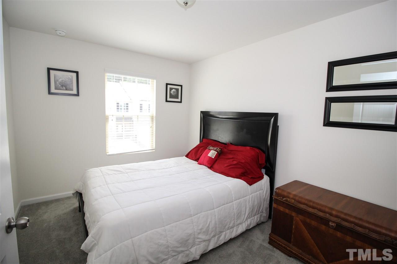 1045 Grand Ridge Drive Rolesville, NC 27571 - Photo 18 of 23 a bedroom with a bed and window