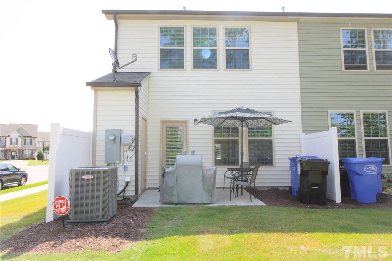 1045 Grand Ridge Drive Rolesville, NC 27571 - Photo 23 of 23 a view of a house with backyard sitting area and garden