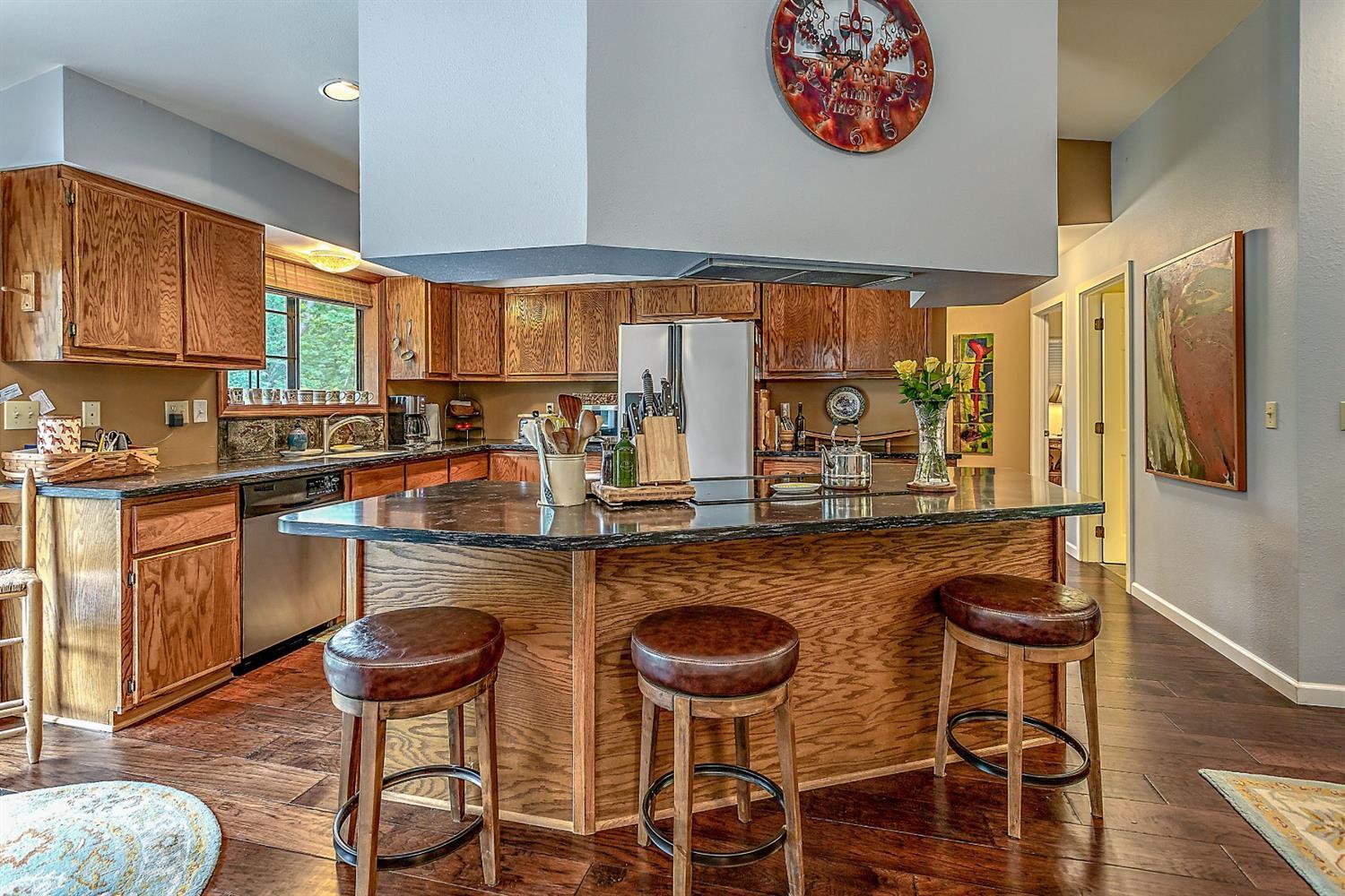 9155 North Applegate Road Grants Pass, OR 97527 - Photo 16 of 35 a kitchen with granite countertop lots of counter top space and dining table