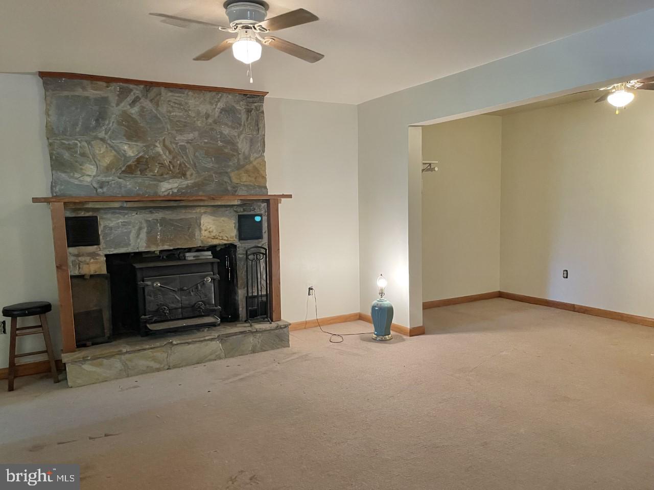 214 Bridle Path Road Front Royal, VA 22630 - Photo 10 of 15 Lower Level Woodstove and Stone Fireplace