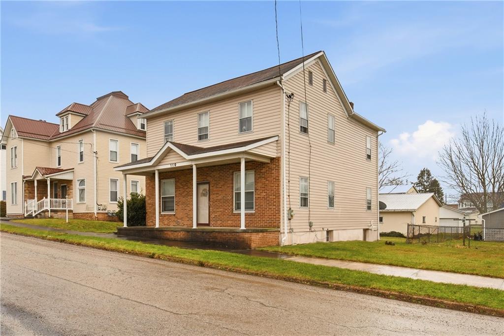 119 Union Street Salisbury, PA 15558 - Photo 4 of 33 a view of a white house with a yard and table and chairs next to door