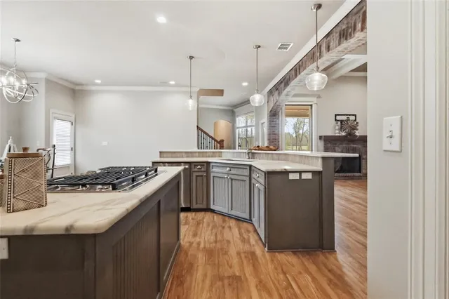 a kitchen with stainless steel appliances granite countertop a stove and a sink