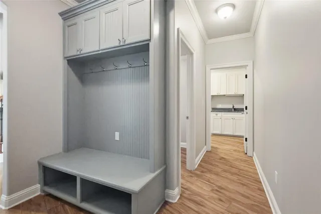 a hallway with wooden cabinets