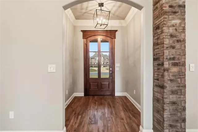 a view of entryway with wooden floor