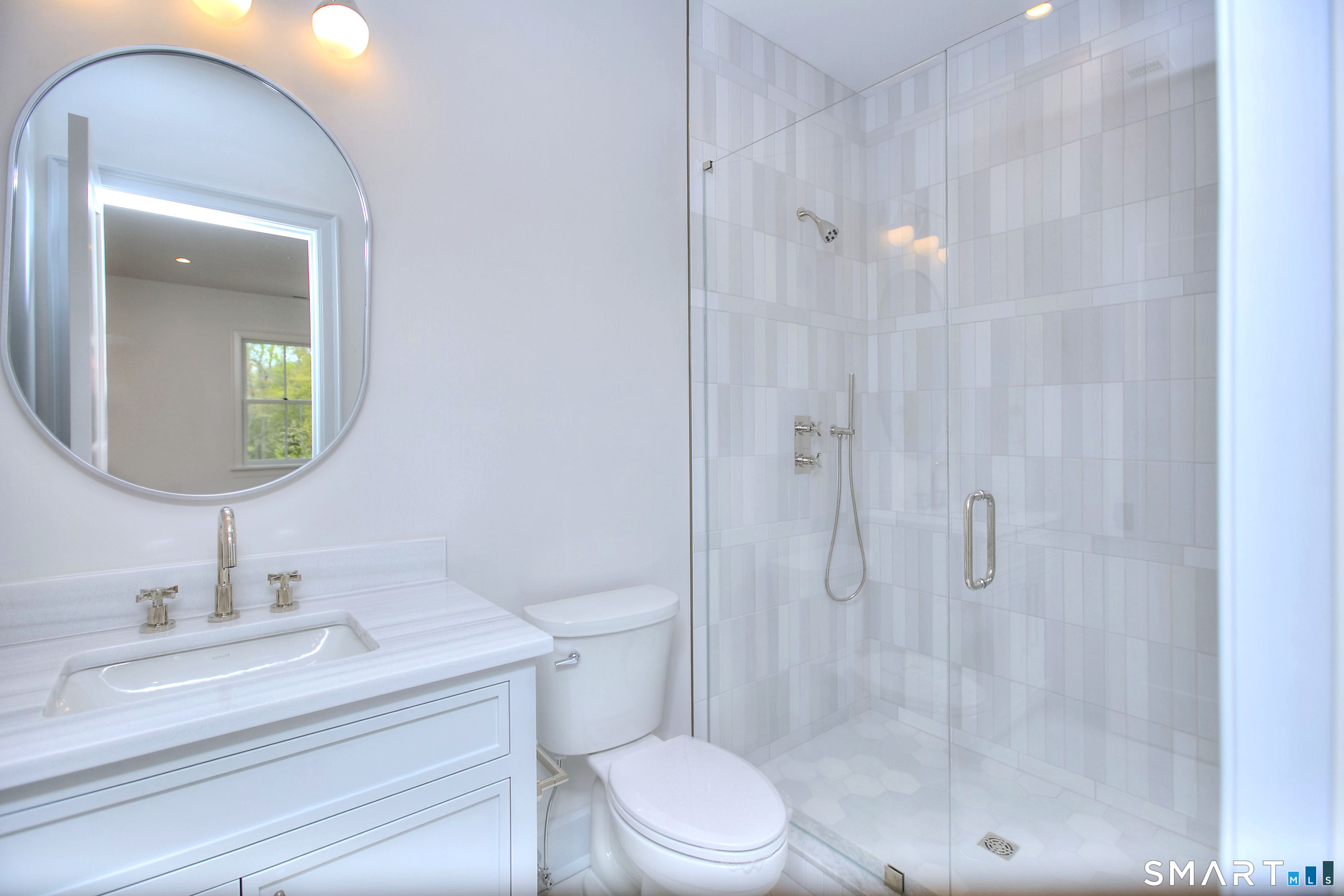 48 Kettle Creek Road Weston, CT 06883 - Photo 32 of 40 a bathroom with a sink a toilet and shower