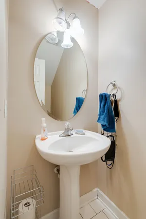 a bathroom with a sink a mirror and vanity