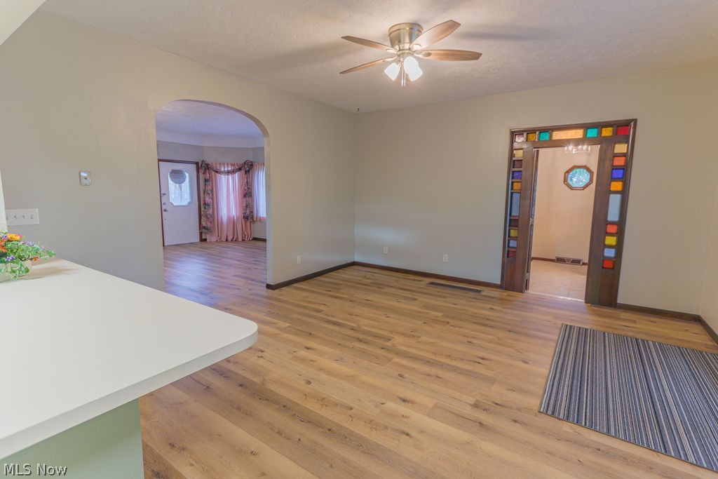 51883 Telegraph Road Amherst, OH 44001 - Photo 22 of 49 Spare room featuring a textured ceiling, hardwood / wood-style flooring, and ceiling fan