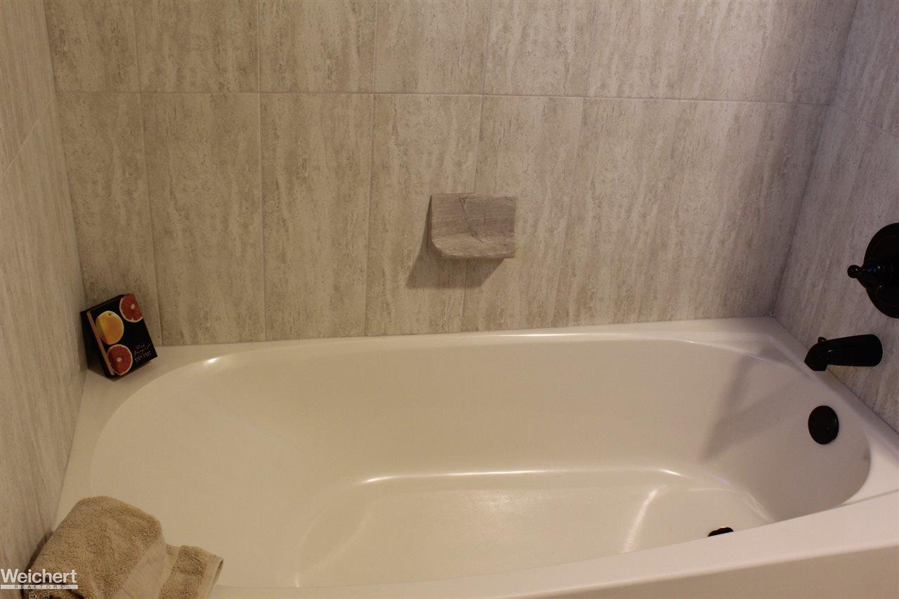 8812 Ridge Drive Washington, MI 48095 - Photo 32 of 44 Full till Walls and Ceiling in Shower area
