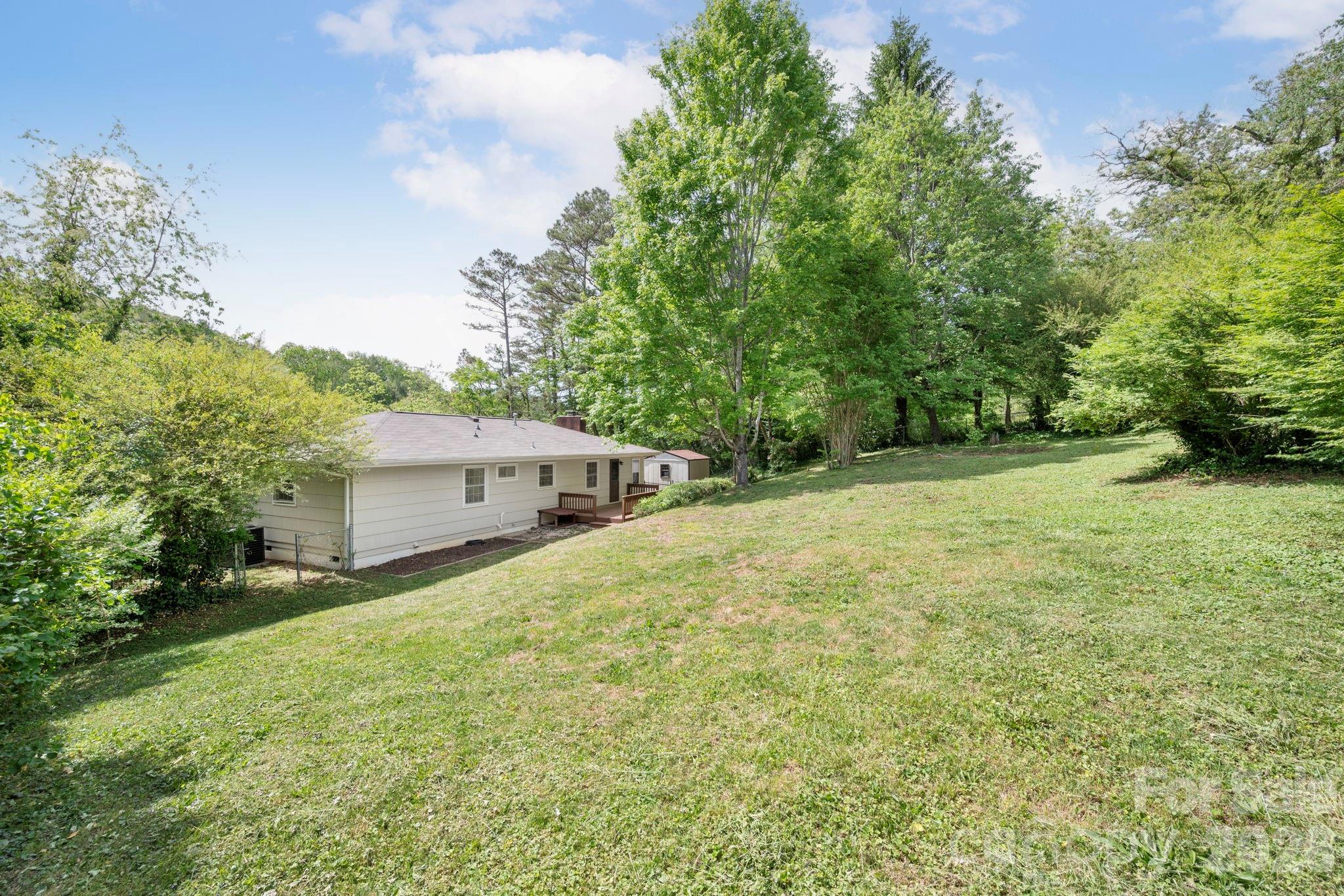 34 Wolfe Cove Road Asheville, NC 28804 - Photo 38 of 42 a house with trees in front of it