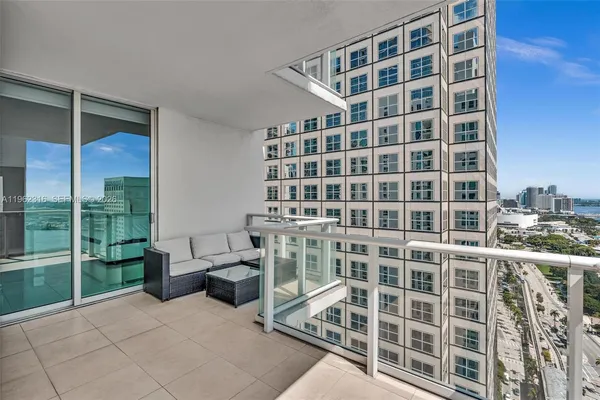 a bedroom with a large bed and furniture