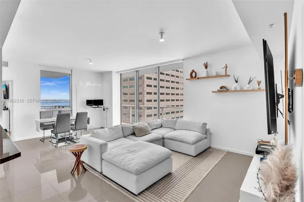 a kitchen with a sink and stove top oven