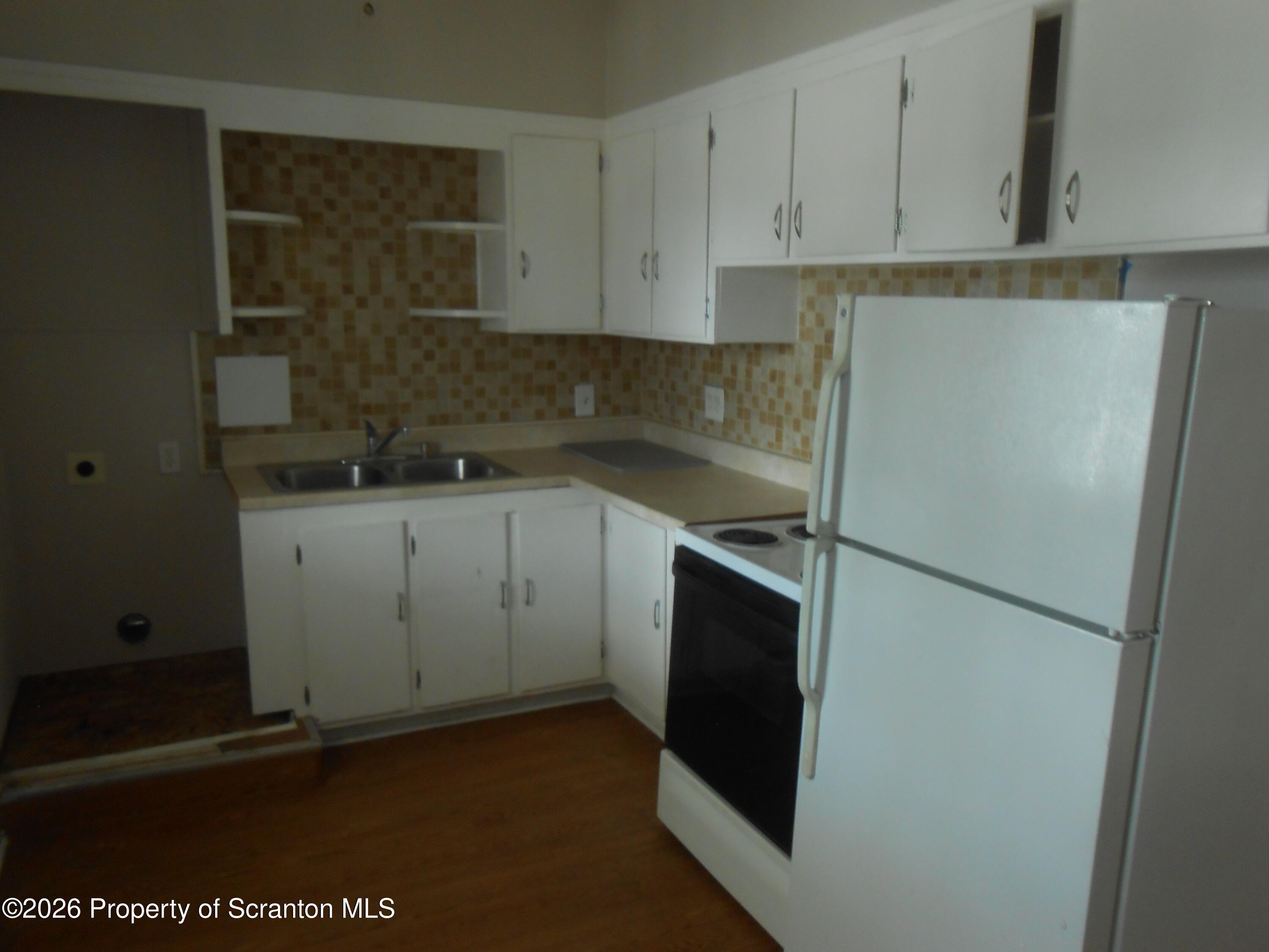 622 North 624 Main, Unit 4 Scranton, PA 18504 - Photo 3 of 19 a kitchen with a sink and refrigerator