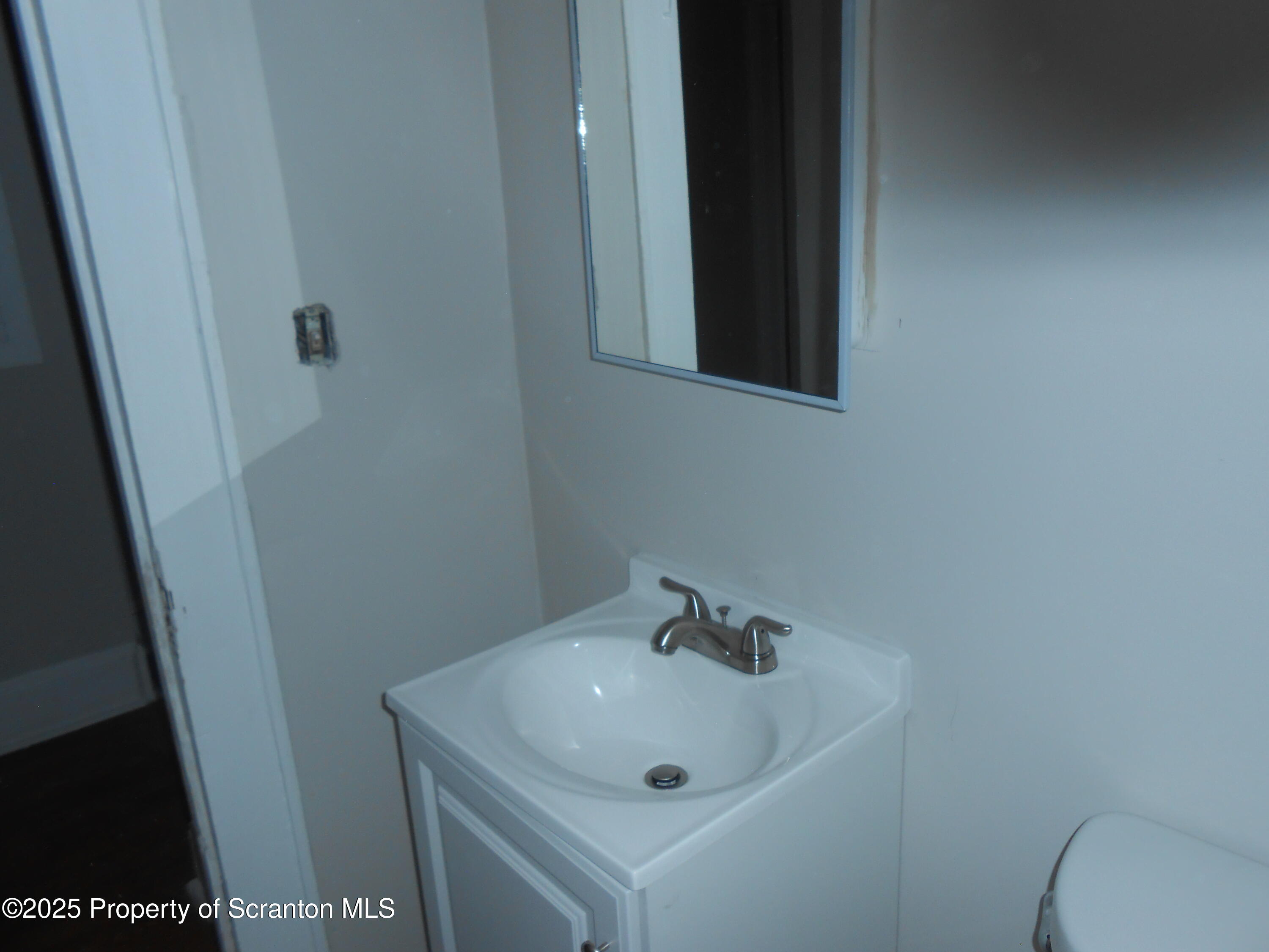 622 North 624 Main, Unit 4 Scranton, PA 18504 - Photo 7 of 19 a bathroom with a sink and mirror