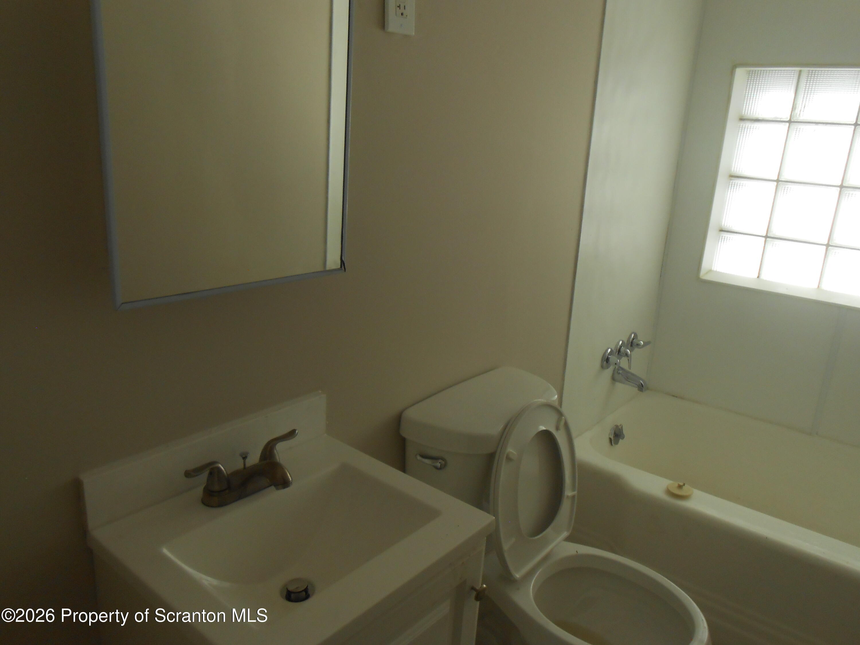 622 North 624 Main, Unit 4 Scranton, PA 18504 - Photo 8 of 19 a bathroom with a sink and a toilet