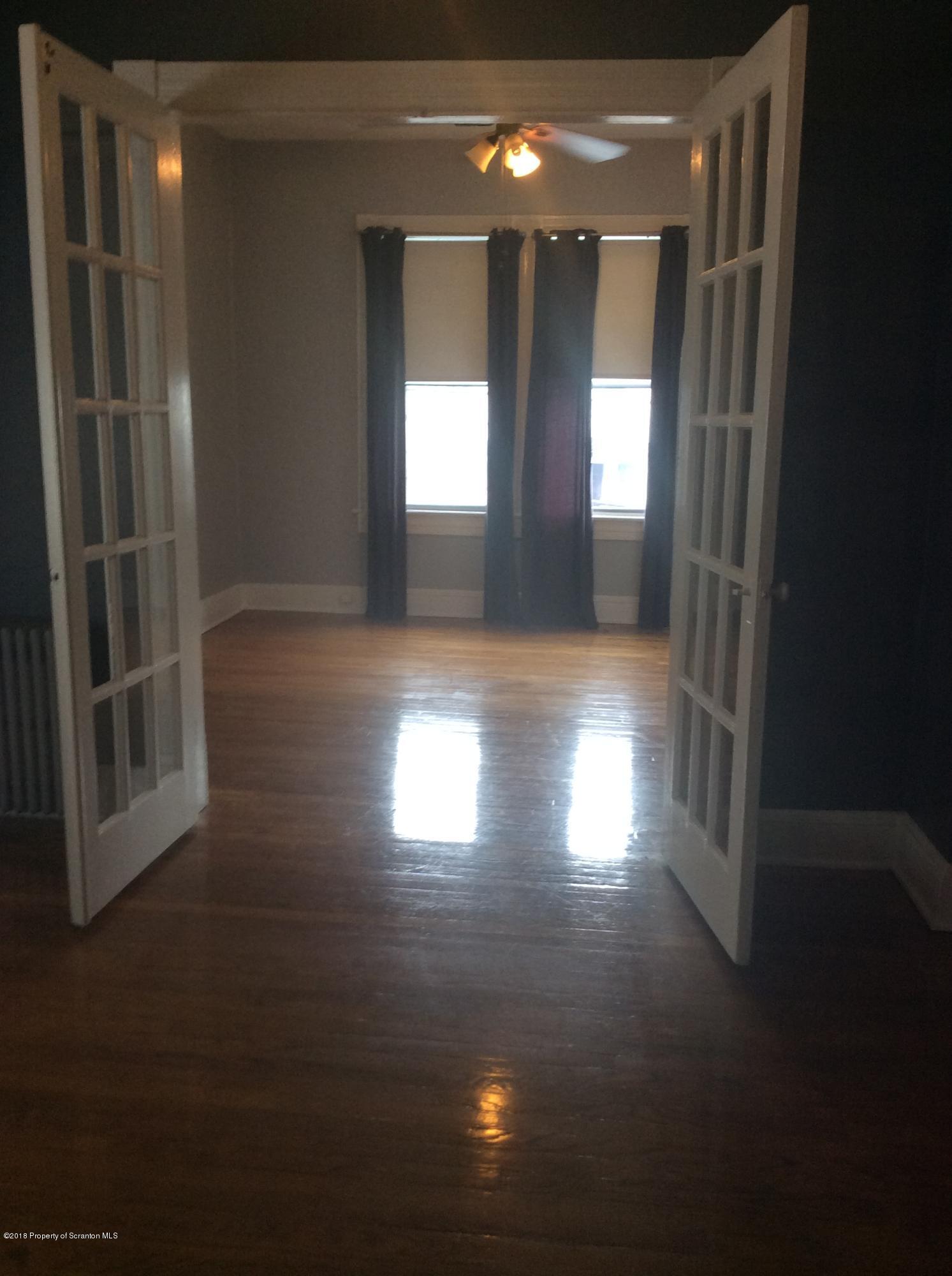 622 North 624 Main, Unit 4 Scranton, PA 18504 - Photo 10 of 19 a view of wooden floor and windows in a room