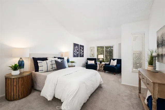 a bedroom with a bed and a couch