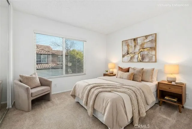 a bedroom with a bed and a couch