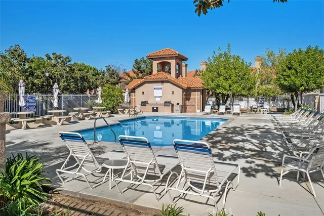 a view of a yard with a table and chairs