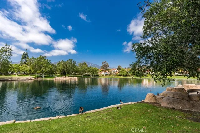 a view of a lake with a house in the background