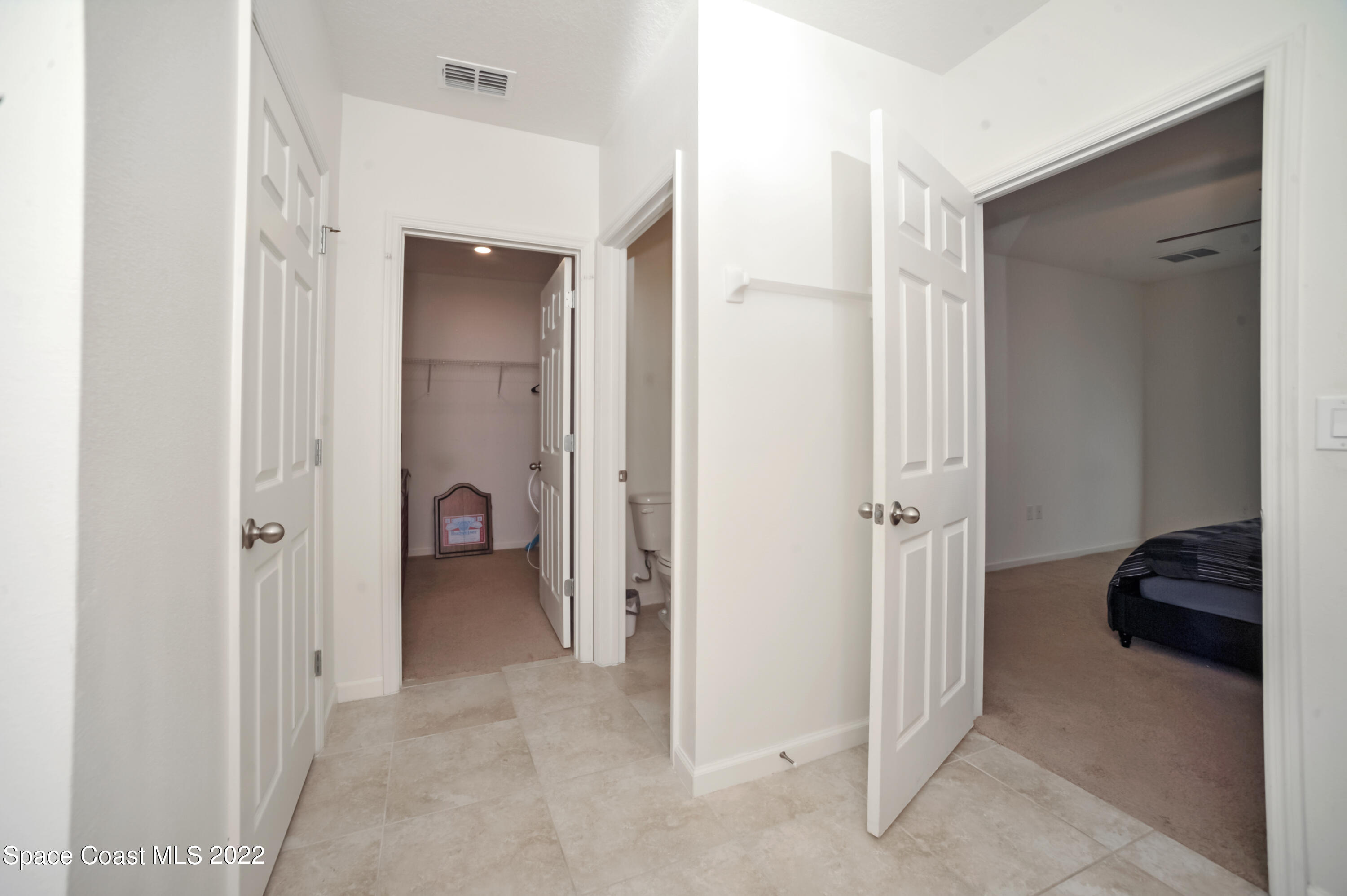 4720 Pagosa Springs Circle Melbourne, FL 32901 - Photo 18 of 24 a view of hallway with closet and a couch