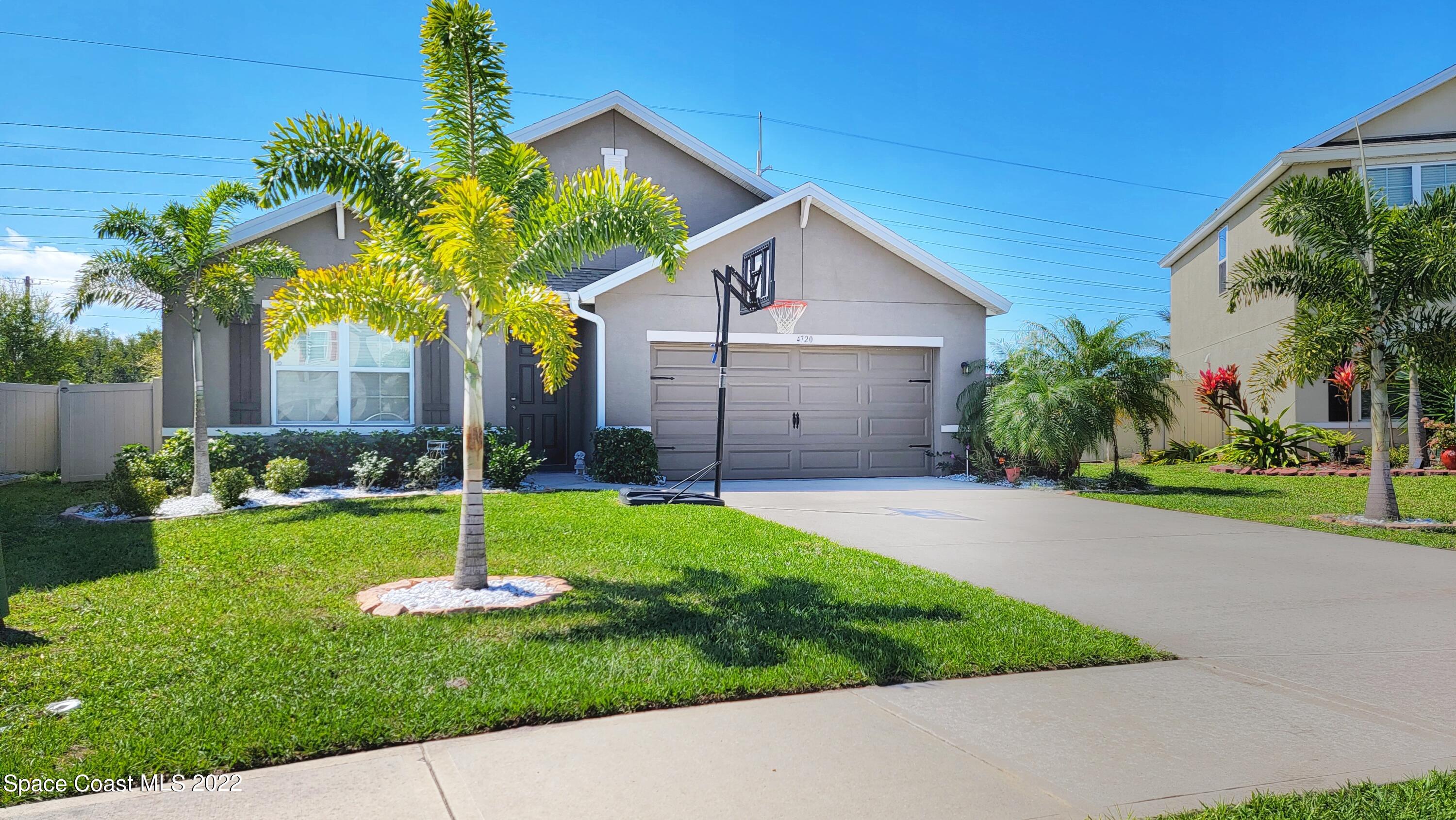 4720 Pagosa Springs Circle Melbourne, FL 32901 - Photo 2 of 24 a view of a backyard with a garden and plants