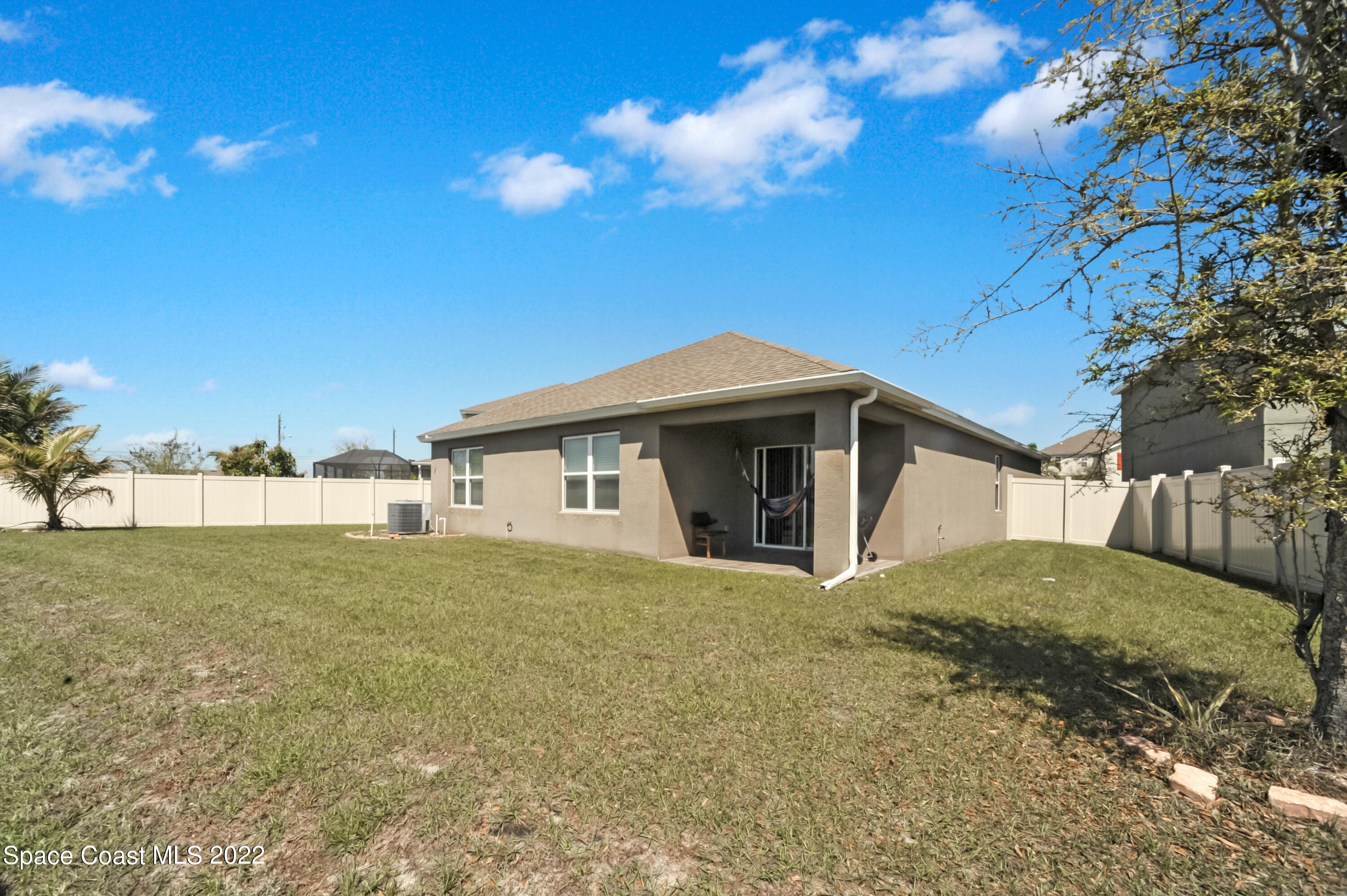 4720 Pagosa Springs Circle Melbourne, FL 32901 - Photo 23 of 24 a view of a house with a yard