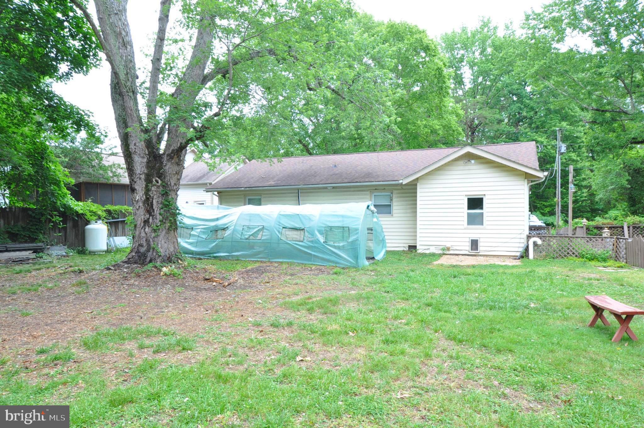 797 Forest Grove Road Colonial Beach, VA 22443 - Photo 39 of 40 Rear Yard with Green Greenhouse