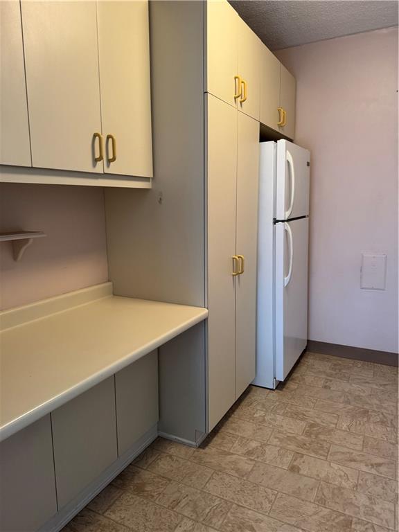1160 Bower Hill Road, Unit 314A Pittsburgh, PA 15243 - Photo 12 of 24 a kitchen with cabinets and stainless steel appliances