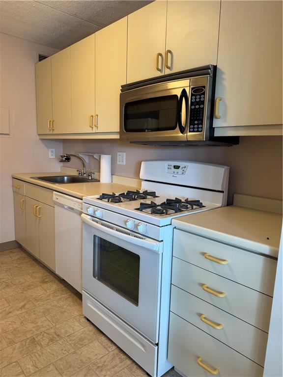 1160 Bower Hill Road, Unit 314A Pittsburgh, PA 15243 - Photo 13 of 24 a kitchen with stainless steel appliances granite countertop a stove microwave and oven